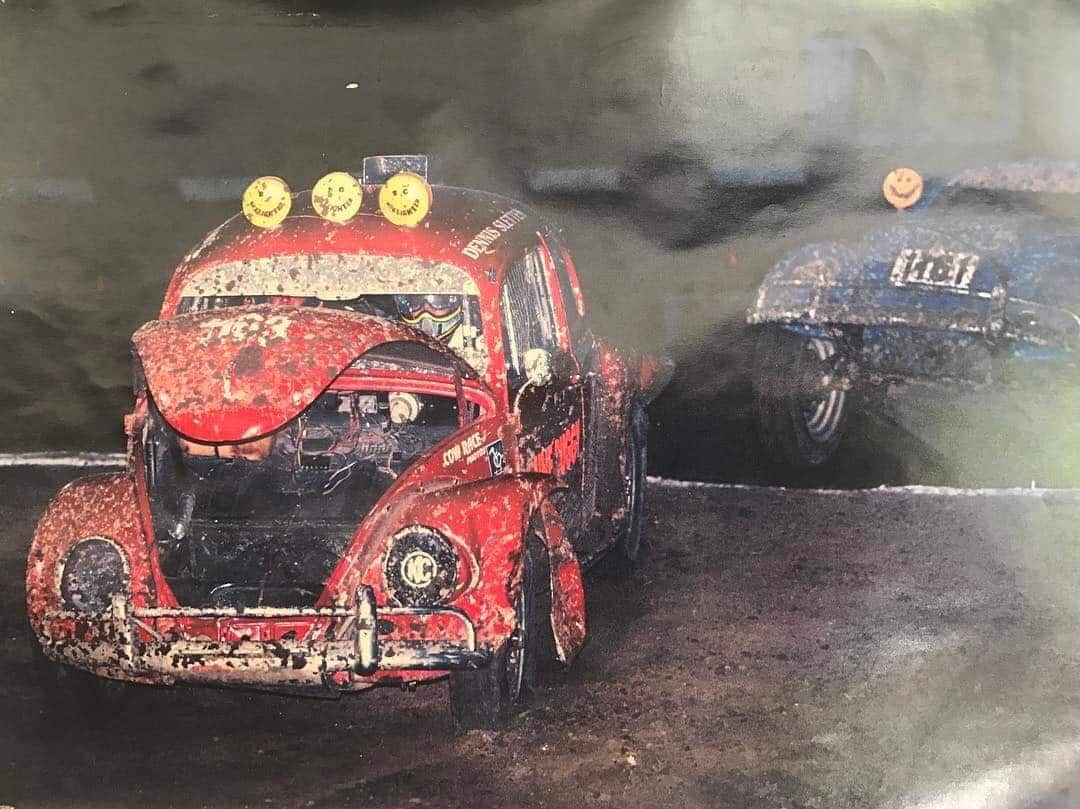 Two VW Bettles racing.