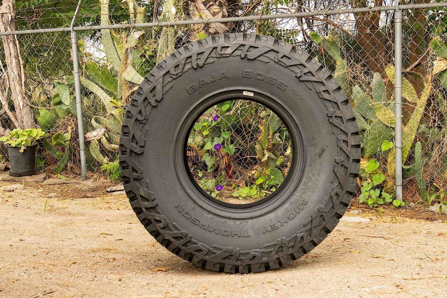 A Micky Thompson Baja Boss A/T Tire on the dirt.