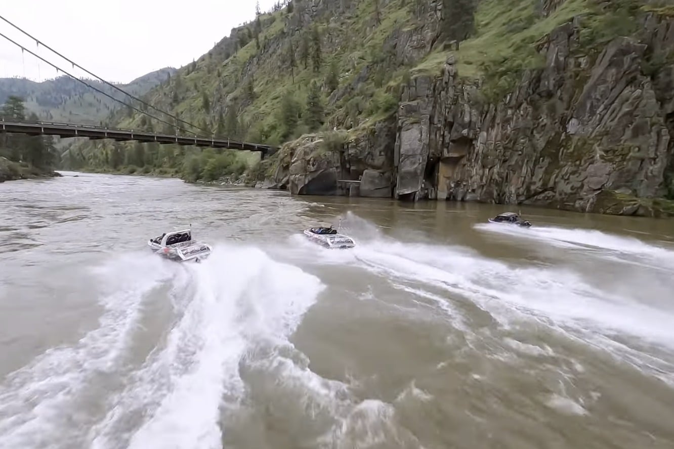 Three mini-boats riding down a river.