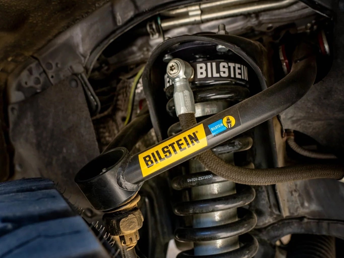 A Blistein control arm installed on a truck.